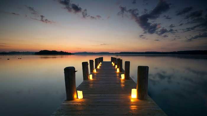 Long jetty with candles