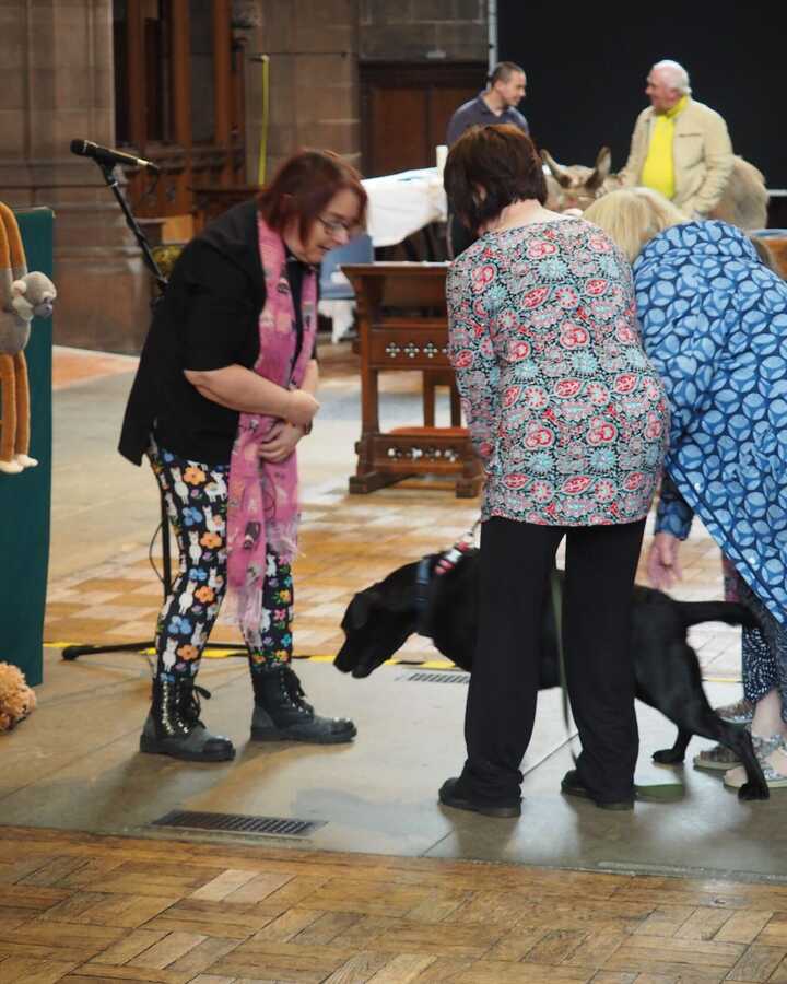 Jenny blessing a dog at the St George's annual animal blessing service