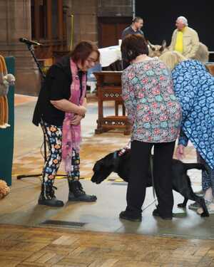 Jenny blessing a dog at the St George's annual animal blessing service